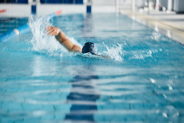 Image showing Athlete, speed or freestyle stroke in swimming pool cap for sports wellness, training or exercise for body healthcare. Workout, fitness and swimmer man in fast motion for water competition challenge