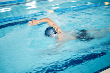 Image showing Man, motion blur or freestyle stroke in swimming pool for sports wellness, training or exercise for body healthcare. Workout, fitness or speed swimmer athlete in water competition or cardio challenge