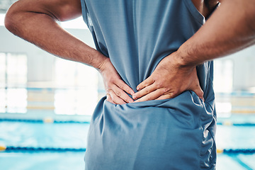 Image showing Back pain, sports and hands of man by swimming pool with injury, muscle ache and inflammation. Wellness, support and athlete with accident, health problem or bruise from fitness, exercise or training