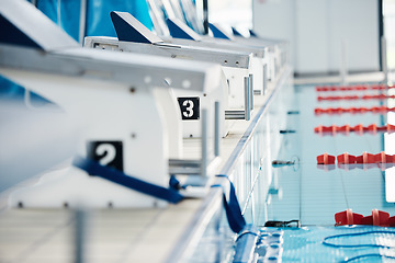 Image showing Sports, competition and podium row by swimming pool for training, exercise and workout for water sport. Fitness mockup, motivation and professional starting block for diving, triathlon and race