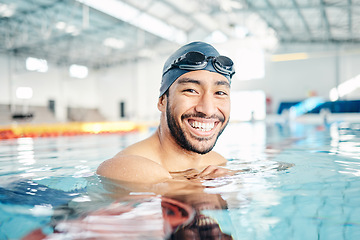 Image showing Portrait, man and relax in swimming pool with cap in sports wellness, training or exercise for body healthcare. Workout, fitness and swimmer athlete with happy face, smile or water competition goals