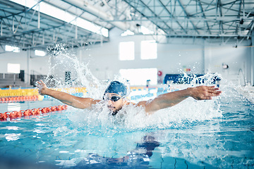 Image showing Man, breathing or butterfly stroke in swimming pool cap for sports wellness, training or exercise for body healthcare. Workout, fitness and swimmer athlete in motion for water competition challenge