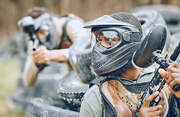 Image showing Paintball, warrior or black man thinking in a shooting game of fighting action on a fun battlefield. Mission focused, military or player with a gun or weapons for survival in an outdoor competition