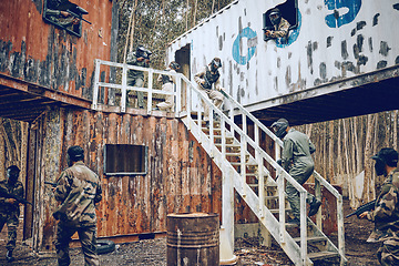 Image showing Paintball, steps or men in a container or shooting game playing with speed, fast or fun action. Mission focus, military or people running in battle with guns for survival in an outdoor competition