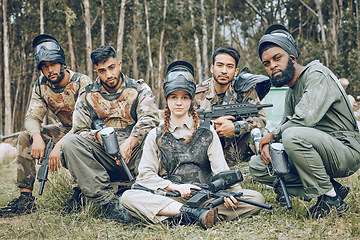 Image showing Paintball, portrait or team in a shooting game playing or training on a fun battlefield in nature. War mission, military or people with guns or weapons gear for survival in a competition in a forest