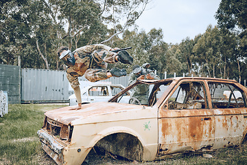 Image showing Car, jump or man in a paintball shooting game playing with speed or fast action on a fun battlefield. Mission focused, military or person running with a gun for survival in an outdoor competition