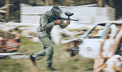 Image showing Paintball, speed or man running in a shooting game playing with fast war action on a fun battlefield. Mission focus, military or guy with a gun or weapon gear for survival in an outdoor competition