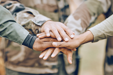 Image showing Army, huddle or hands with a mission, strategy or motivation on a paintball or military battlefield in nature. Goals, team work or people with support in a partnership or group of ready soldiers