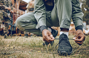 Image showing Shoes, tie or hands in a paintball shooting game playing with speed or fast action on a fun battlefield. Mission focused, footwear or man ready to fight for survival in an outdoor war competition