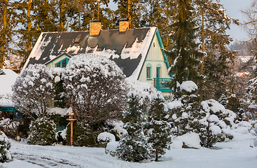 Image showing beautiful house in winter garden covered by snow