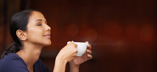 Image showing Coffee, calm and woman smelling the aroma in a studio with mockup space for advertising or marketing. Peace, relax and female model from Mexico enjoying the scent of a cappucino by maroon background.