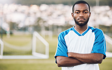 Image showing Sports, black man and portrait of soccer player on field, focus and motivation for winning game in Africa. Confident, proud face and serious mindset at professional football exercise training match.
