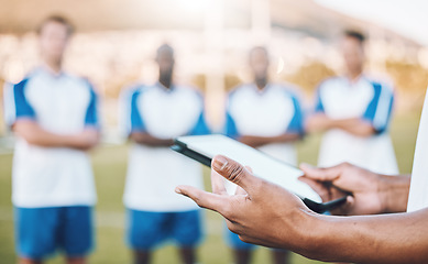 Image showing Football, soccer and team statistics on a tablet and coach analysis online, internet or website on a sports field. Teamwork, digital and tactics by modern trainer tracking performance analytics