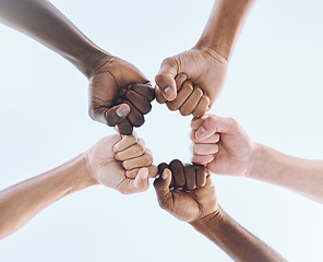 Image showing People, team and hands or fist bump of men in support of sport, collaboration and game strategy on sky. Teamwork, players and man group hand huddle for fitness, motivation and bottom of training goal