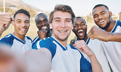 Image showing Fist, soccer and portrait of a team selfie at training, game or competition on a field. Fitness, diversity and strong football players with a photo after winning, achievement and sports in France