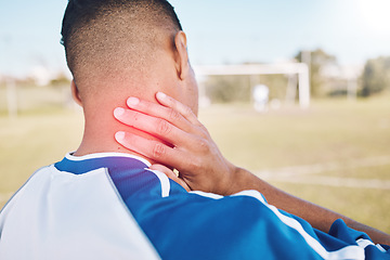 Image showing Fitness, field and athlete with neck pain, injury or accident from soccer match, exercise or training. Sports, workout and football player with medical emergency or muscle sprain at outdoor stadium.