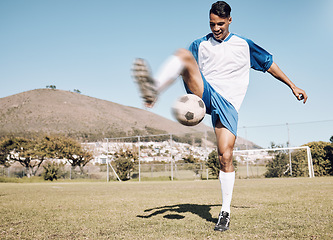 Image showing Football outdoor, happy soccer player and man athlete with sports cardio, training and exercise on field. Kick, game and workout with fitness and running for wellness and health for game with energy