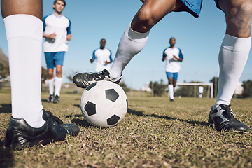 Image showing Fitness, soccer team and athletes playing on the field at a game competition, league or championship. Sports, football and male sport players running with a ball at an outdoor match on soccer field.