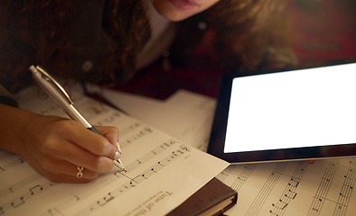 Image showing Music notes, tablet and black woman writing on paper for song lyrics, audio and create track beat. Musician, creative studio and hand of girl write on sheet with mockup digital screen for musical app