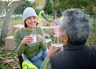 Image showing Volunteer, coffee and break by women relax after community service, cleanup and project in park, happy and bond. Charity, environment and recycling friends resting in a forest with tea and a talk