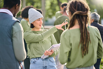 Image showing Volunteer schedule, community cleaning leader and charity service outdoor with Asian woman talking. Recycle team, collaboration and eco friendly female manager giving recycling teamwork orders