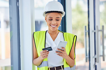 Image showing Construction worker, woman and ecommerce with credit card and smartphone, happy with payment and bank. Internet, banking and online shopping with contractor, stock purchase with retail and mobile app