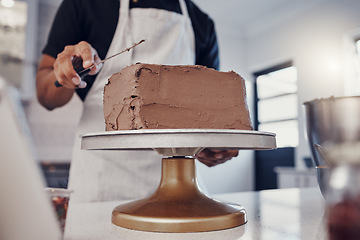 Image showing Frosting, baking and man with a cake in the kitchen for birthday food, dessert and pudding. Cooking, preparation and baker learning to decorate a sweet treat for a celebration on a table in a house