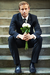 Image showing Stairs, portrait and man with flowers for valentines day, romance or gesture while sitting outdoors. Roses, face and gentleman with bouquet for love, anniversary or first date, confident and handsome