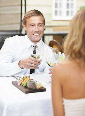 Image showing Love, toast and wine with couple at restaurant for food, valentines day and celebration. Champagne, fine dining and relax with happy man and woman at table flirting for smile, marriage and date