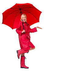 Image showing Portrait, red raincoat and umbrella for insurance with a woman in studio isolated on a white background. Winter, rain and weather with an attractive young female on blank space to promote life cover