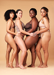 Image showing Diversity women, portrait and body positivity friends hug for inclusion, beauty and power. Underwear model group beige background for cellulite legs, pride and motivation for self love or skin care