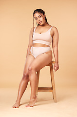 Image showing Woman sitting, portrait with underwear and body, positivity and beauty, fitness and skin isolated on studio background. Health, wellness and happy with nutrition, cellulite and dermatology mockup