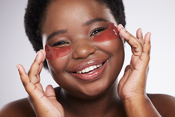 Image showing Black woman, face and happy with eye patch for skincare, healthy skin and portrait isolated on studio background. Hands, shine and natural cosmetics, dermatology and facial care with beauty mask