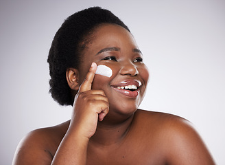 Image showing Beauty, cream and black woman isolated on a white background for skincare, product or apply cosmetics. African model or person face with collagen, moisturizer .and dermatology idea in studio mockup