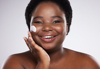 Image showing Black woman, portrait and cream for skin in studio for cosmetic beauty, smile and happiness by background. Facial product, happy african model and skin glow with natural aesthetic for face wellness