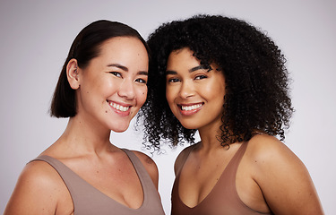 Image showing Women, face and diversity with portrait, smile with skincare for different skin color with beauty isolated on studio background. Natural cosmetics, glow and dermatology, inclusion and facial care