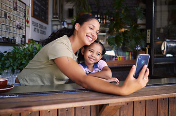 Image showing Coffee shop, black family and selfie with a mother and daughter enjoying time together in a cafe. Photograph, picture and memories with a woman and happy female child bonding in a restaurant