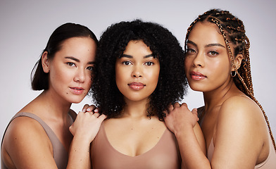 Image showing Portrait, makeup and diversity with woman friends in studio on a gray background together for skincare. Face, beauty and natural with a female model group posing to promote support or inclusion