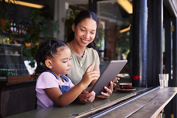 Image showing Tablet, coffee shop and happy mother with her child reading the online menu before ordering. Technology, internet and mom on a date with her girl kid with a touchscreen mobile device in a cafe.