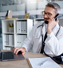 Image showing Laptop, man and doctor on phone call, talking or chatting to contact for consultation in hospital. Telehealth, telephone and mature male medical professional networking, conversation or discussion.