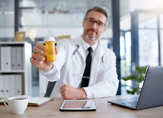 Image showing Doctor hands, portrait and pills in hospital for healthcare, wellness and health in clinic. Medicine, medication and male physician holding medicinal drug product or prescription for healthy cure.