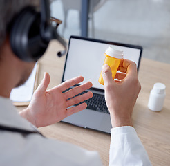 Image showing Pills, headphones and doctor on laptop video call, webinar or online consultation. Computer telehealth, medication and hands of man with drug product, medicine or prescription on internet conference.