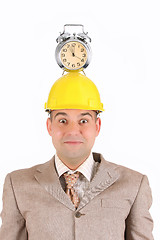 Image showing businessman clock alarm on his head 