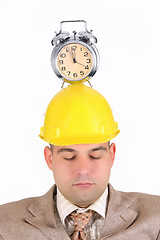 Image showing sleepy businessman with clock alarm 