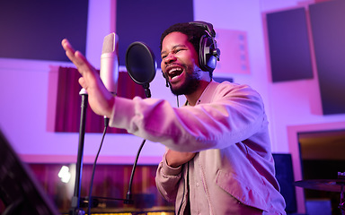 Image showing Musician, singing or black man on neon microphone, music studio equipment or practice in theatre recording. Singer, rapper or artist on production, voice media or sound performance in light theater