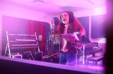 Image showing Technology, singing or woman on neon studio microphone, music lyrics or songwriting app in night recording. Singer, musician or artist on tablet in production, voice media or sound light performance