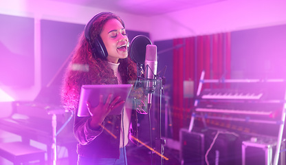 Image showing Technology, singing or woman on neon studio microphone, music lyrics or songwriting app in night recording. Singer, musician or artist on tablet in production, voice media or sound light performance