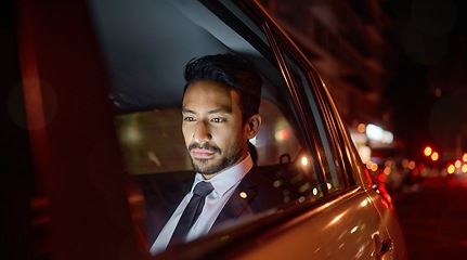 Image showing Night, travel and business man in car relaxing, commuting and traveling after working. Transport, road and young male professional, passenger or businessman sitting in vehicle, motor or taxi in city.