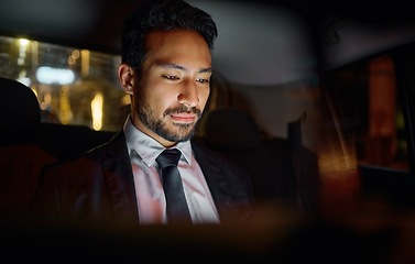 Image showing Travel, night and business man in car relaxing, commuting and traveling after working. Transport, road and young male professional, passenger or businessman sitting in vehicle, motor or taxi in city.