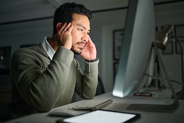 Image showing Business man, computer stress and headache in office while working on project deadline at night. Mental health, burnout and male employee on pc with anxiety, depression or migraine in dark workplace.